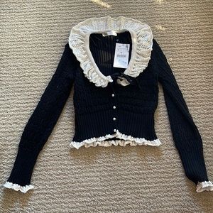 Brand new black and white ruffle Zara cardigan.